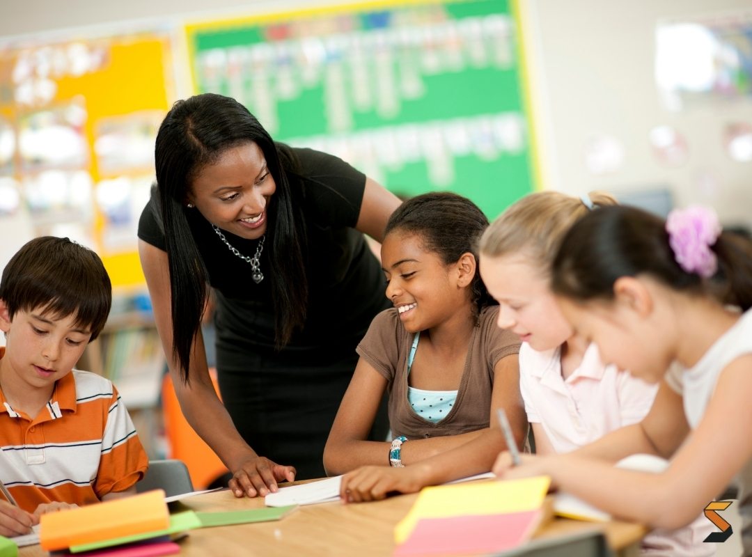 Teacher with students in a group exercise