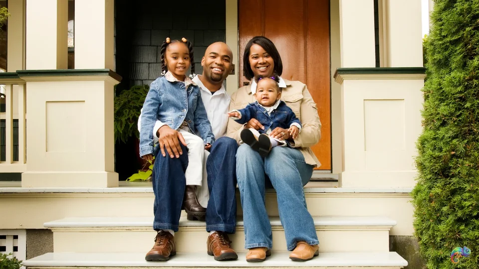 Beautiful family in front of their home
