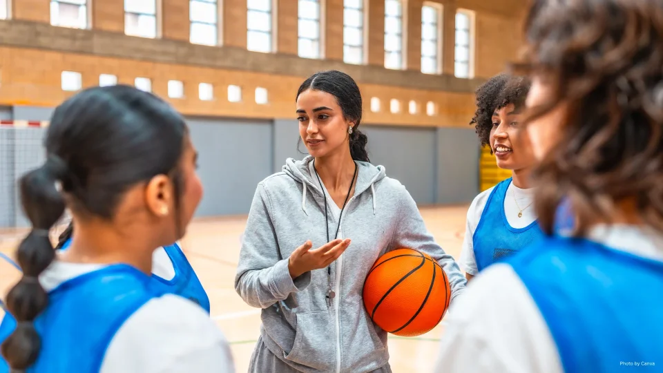 High School Basketball Coach with Athletes