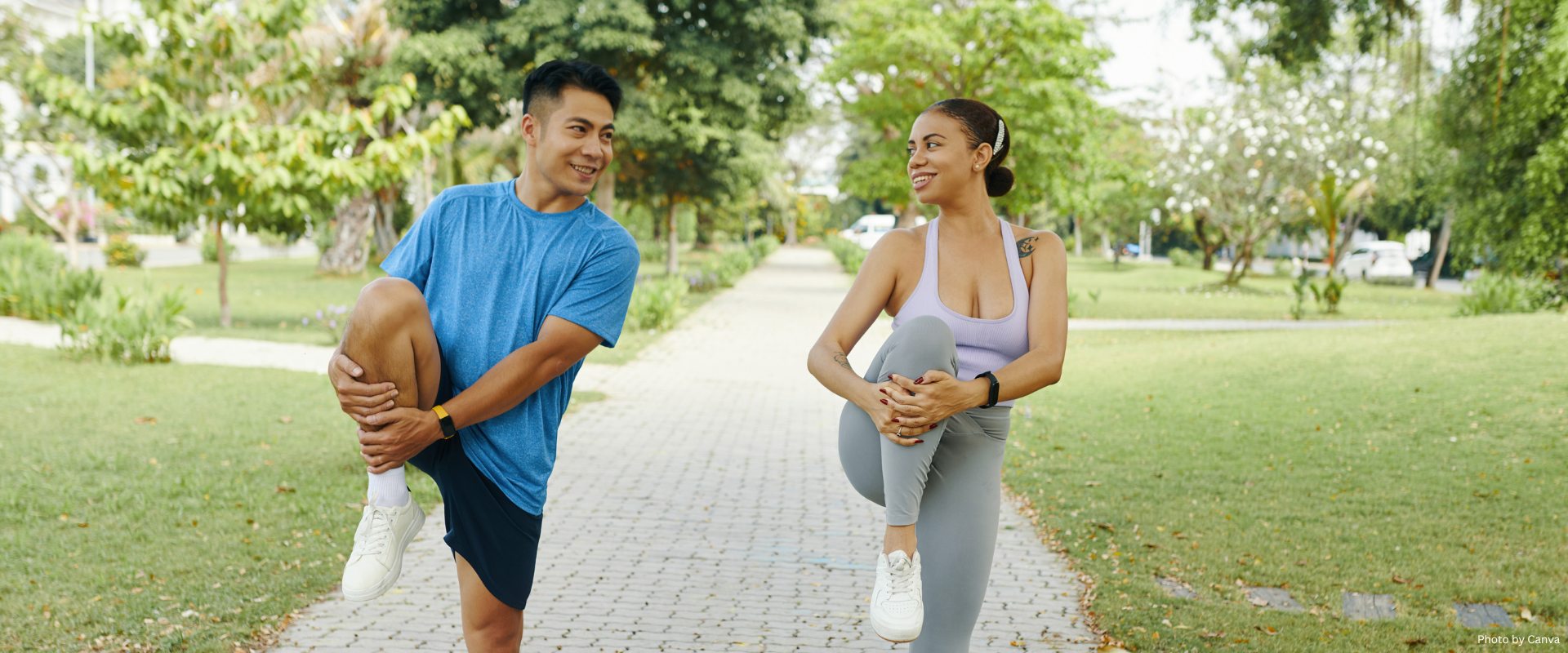Happy couple doing leg stretch excercise