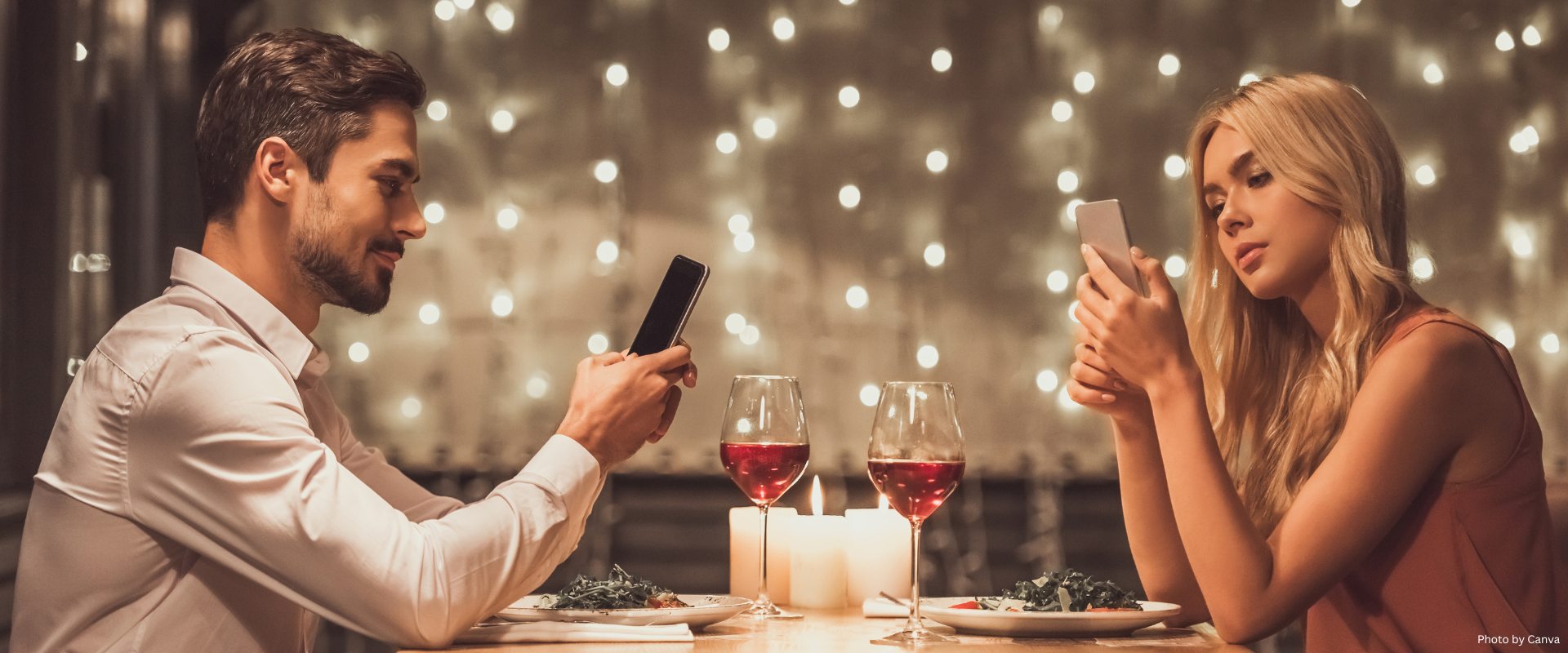 couple on their cellphone while on a date in a restaurant