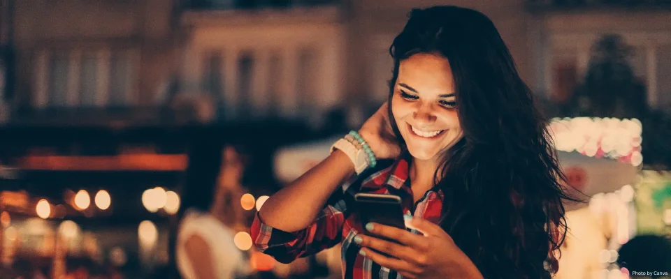 Female smiling while on her phone