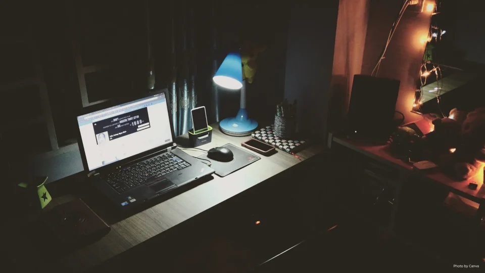 Laptop on Desk in dimmed room