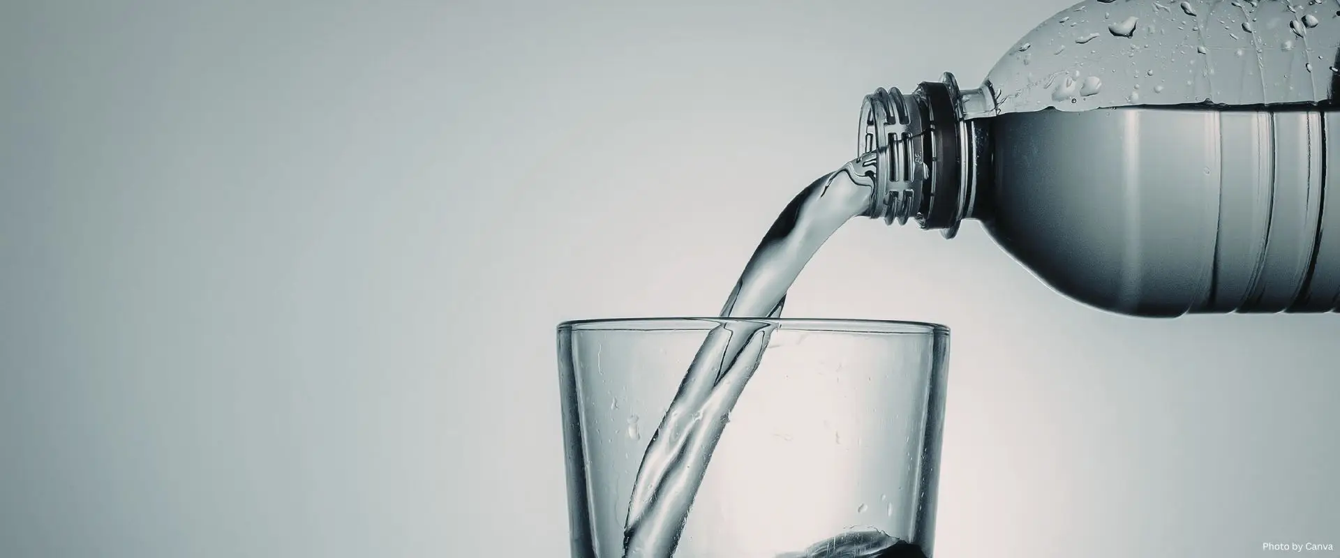 Pouring water into a glass