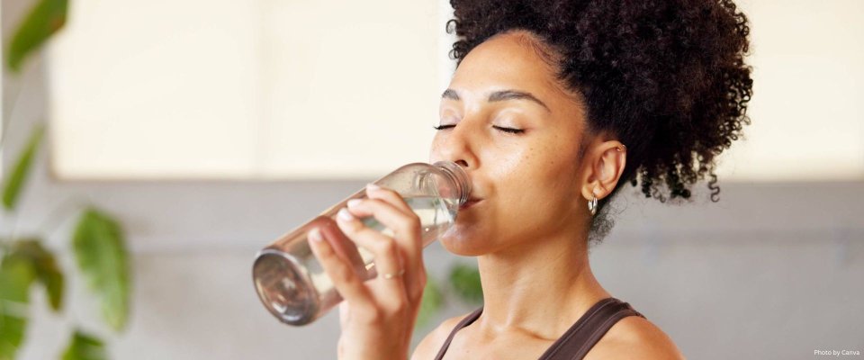 African American Female drinking water