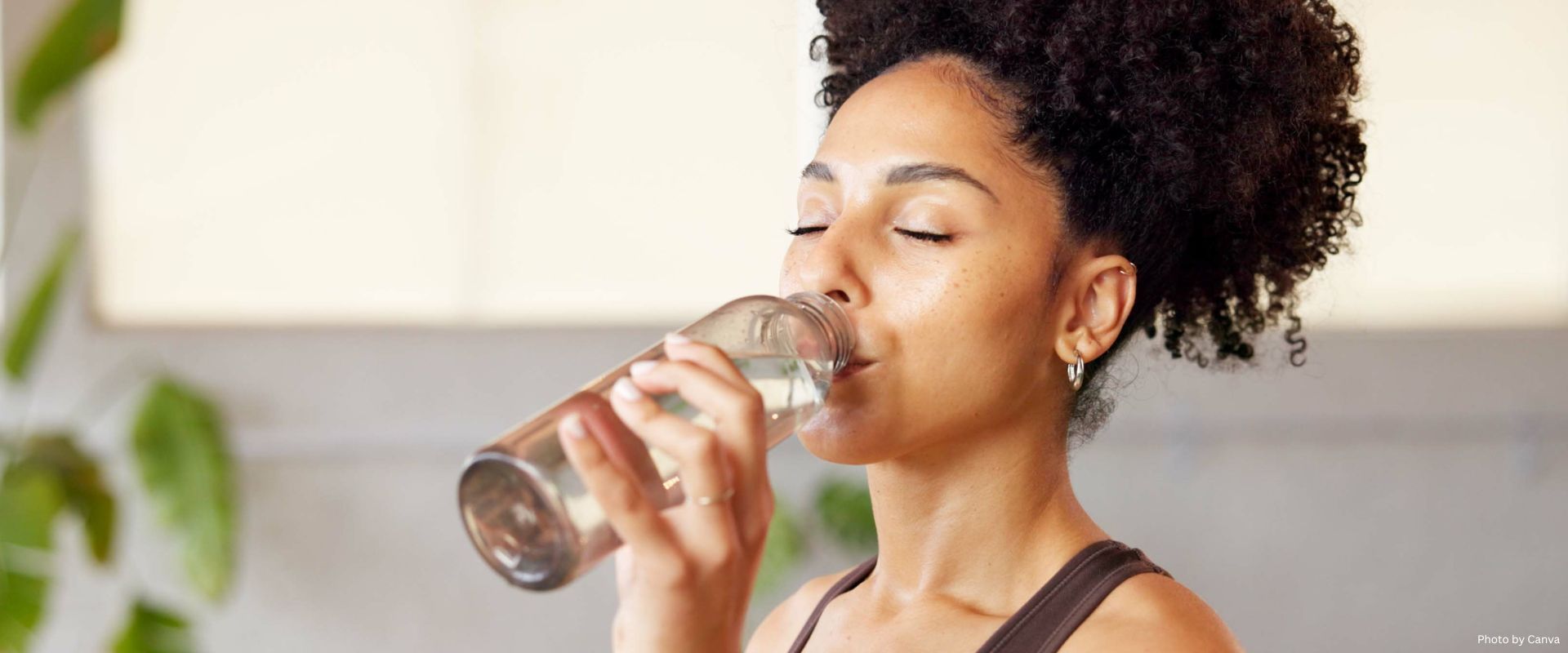 African American Female drinking water