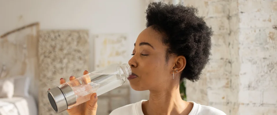 Black woman drinking water